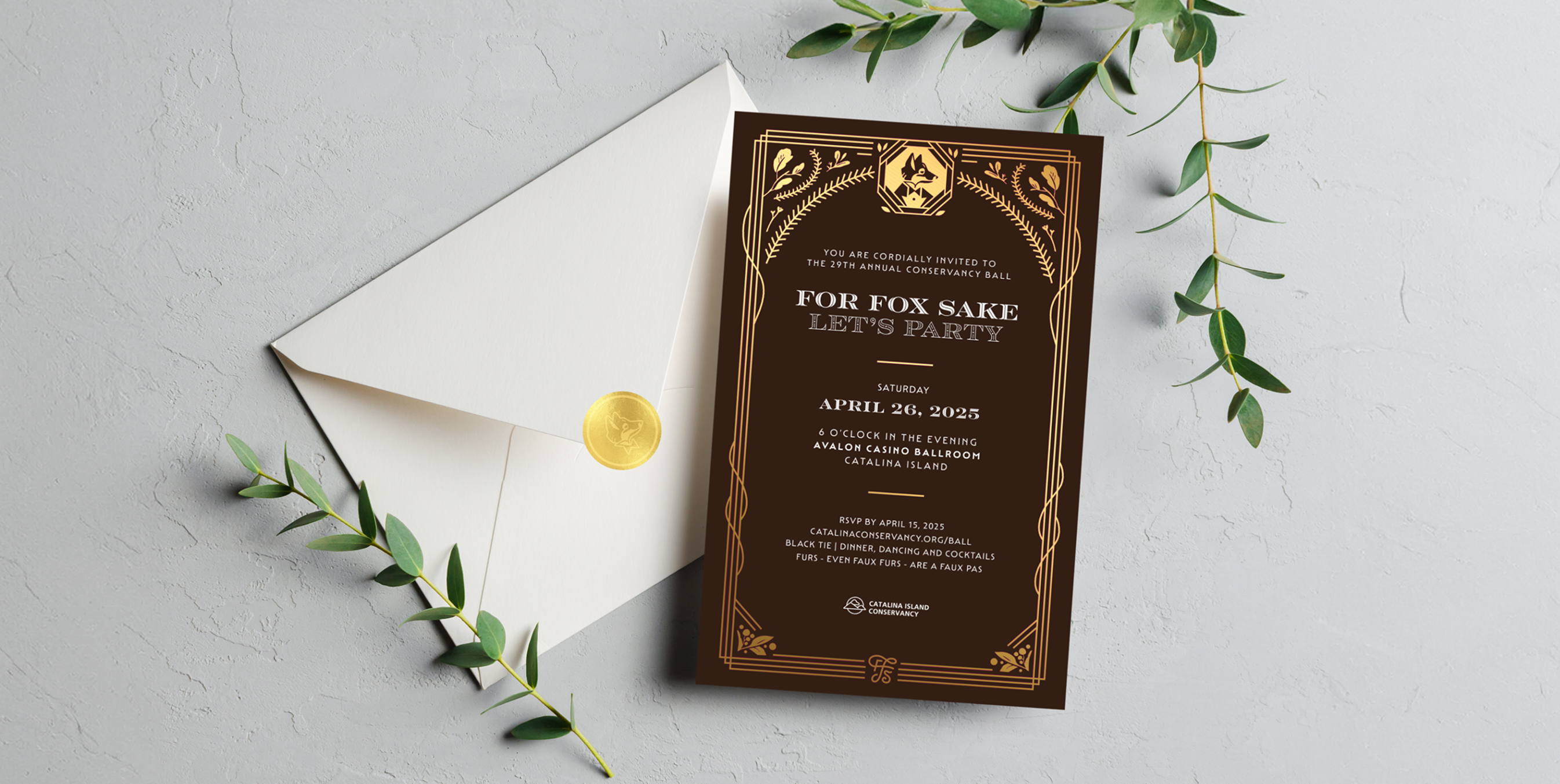 Elegant brown and gold invitation card for the Catalina Island Conservancy gala, titled “For Fox Sake, Let’s Party,” displayed with an envelope and greenery accents.