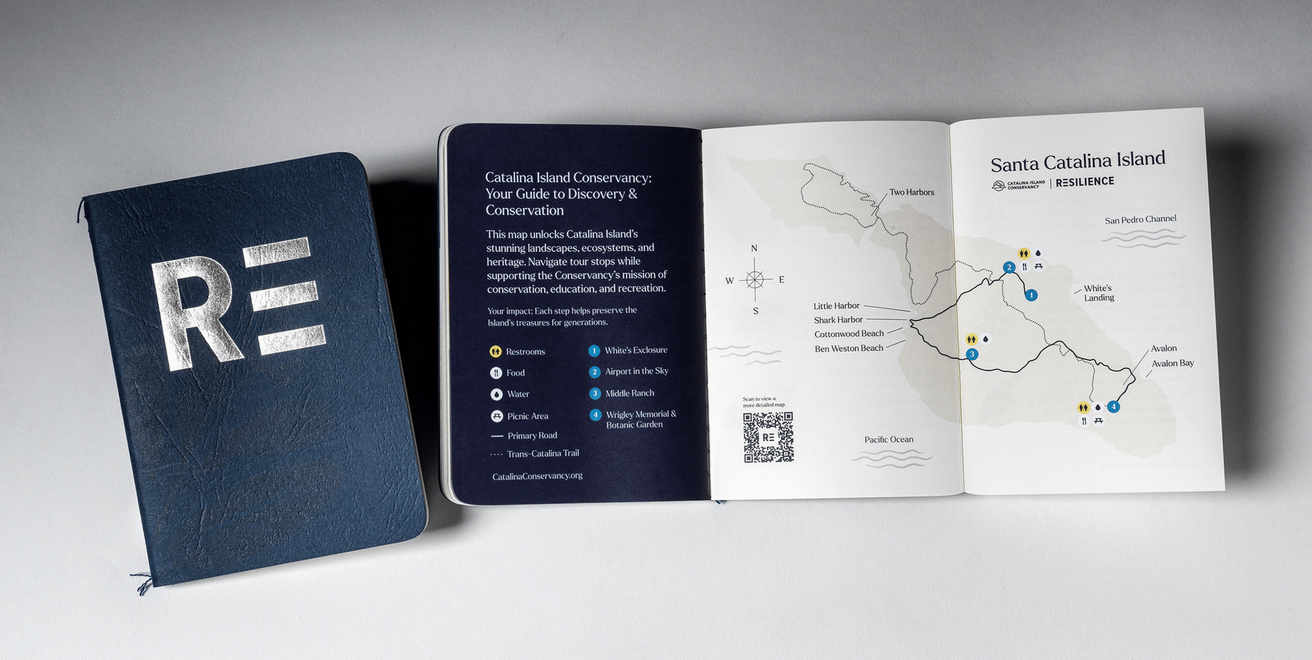 Resilience campaign booklet with metallic “RE=” cover shown next to an open spread featuring a fold-out map of Catalina Island and visitor information.
